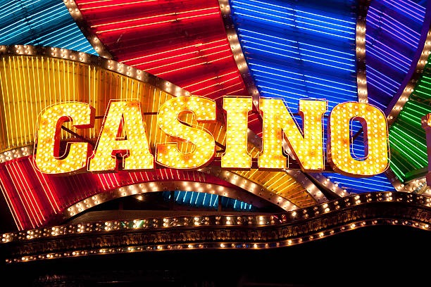 Live casino dealer in professional studio with multiple camera angles